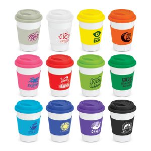 115063 Trends Collection Aztec Coffee Mug - Promotrenz The Trends Collection Aztec Coffee Mug is a 350ml ceramic coffee mug with silicone band and push on lid. White mug with 12 colour options for the band.