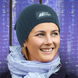 The Trends Collection Nebraska Cable Knit Beanie with Patch is a stylish cable knit beanie.  Acrylic Yarn.  4 colours.  Printing on patch.  Great branded headwear.