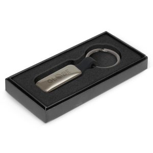 112521 Trends Altos Key Ring Rectangle - Promotrenz The Trends Altos Key Ring is a rectangular, opulent, silicone and metal key ring. Engraved. Gunmetal. Great branded key rings for your clients.