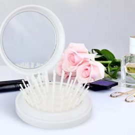 The Trends Compact Brush with Mirror is a foldable plastic hairbrush with mirror.  White or Black.  Great branded travel promotional products.