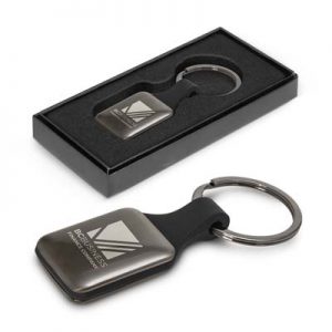 112522 TRENDS Altos Key Ring Square The Trends Altos Key Ring is a square, opulent, silicone and metal key ring. Engraved. Gunmetal. Great branded key rings for your clients.