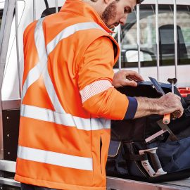 The Syzmik Unisex Hi Vis 2 in 1 X Back Soft Shell Jacket is a 100% polyester, water resistant, hi vis jacket. Orange. Sizes XXS - 5XL, 7XL.
