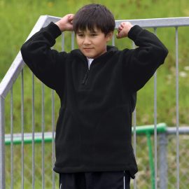The Catalogue Youth Detailed Polar Fleece Pullover is a classic fit pullover with pockets. Available in Black. Sizes 8 - 14.
