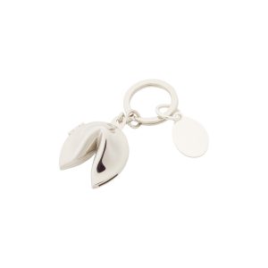 The Catalogue Fortune Cookie Keyring is a nickel plated keychain with a metal fortune cookie attached. Branding tag attached.