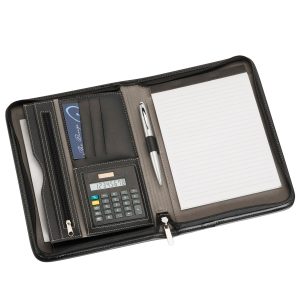 The Catalogue A5 Zippered Compendium With Calculator is a leather-look compendium with multiple pockets. Solar calculator. Writing pad.