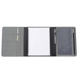 The Catalogue Trekk Tri-Fold Business Compendium is a grey melange polyester cover with pockets. Lined pad included. Elastic closure.