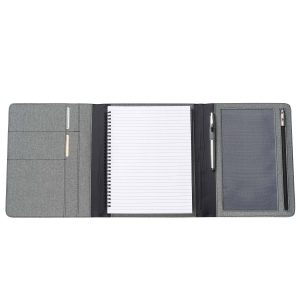 The Catalogue Trekk Tri-Fold Business Compendium is a grey melange polyester cover with pockets. Lined pad included. Elastic closure.