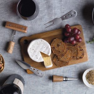The Catalogue Apero Fromage Set is a 5 piece, acacia wood, cheese set. Includes a serving board, corkscrew, bottle stopper, a knife and fork.