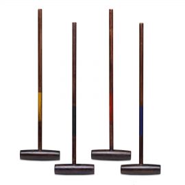 The Catalogue Backyard Croquet Set is an antique natural wood grain croquet set. Includes mallets, balls, stakes, hoops and flags.
