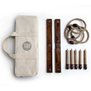 The Catalogue Backyard Quoits Set is an 11 piece, antique natural wood quoits set. Includes running boards, stakes and rope rings.