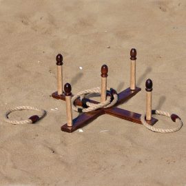 The Catalogue Backyard Quoits Set is an 11 piece, antique natural wood quoits set. Includes running boards, stakes and rope rings.