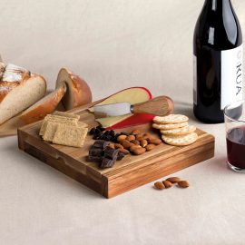 The Catalogue Clamshell Cheese Board is an Acacia hardwood board with 4 utensils. Includes 3 knives and 1 fork.