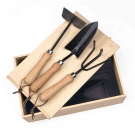 The Catalogue Dig It Garden Box is a natural pine wood box with a 3 piece garden set. Includes a cultivator, spade trowel and soil hoe.