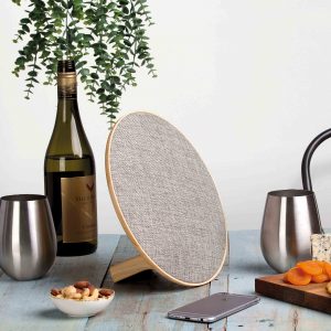 The Catalogue Lounge Disc Bluetooth Speaker is a wireless speaker with a fabric face. USB charging cable included.