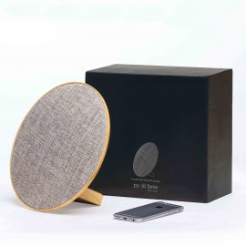 The Catalogue Lounge Disc Bluetooth Speaker is a wireless speaker with a fabric face. USB charging cable included.