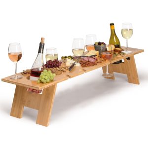The Catalogue Lungo Tavolo Table is a foldable bamboo table. Alfresco style with holders for bottles and glasses.