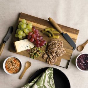 The Catalogue Meze Gourmet Set is a 7 piece acacia set. Includes a serving board, knives, spoons and ceramic bowls. Each piece has unique wood grain.