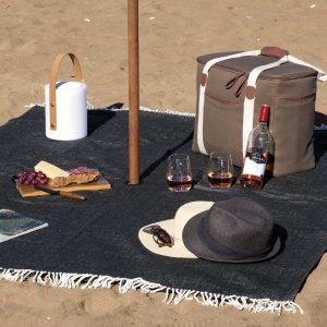 The Catalogue Ombrello Picnic Blanket is a 100% acrylic fabric, polyester backed blanket. Centred hole for umbrella.