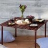 The Catalogue Roll Table is a dark mahogany, hardwood table. Foldable and easy to stow away in the included carry bag.
