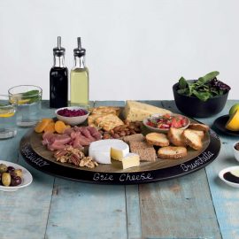 The Catalogue Squisito Lazy Susan is an acacia hardwood lazy Susan. 18-inch circular, rotating board. Chalkboard rim for labelling.