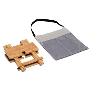 The Catalogue Tavolo Table is a foldable, bamboo table with integrated wine glass holders. Packs away into a carry bag with shoulder strap.