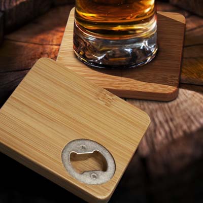 The TRENDS Bamboo Bottle Opener Coaster Set of 2 is 2 x natural bamboo coasters with bottle opener on underside.  Engraving or printing available.