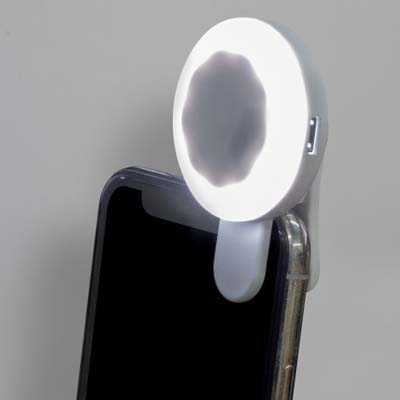 The TRENDS Halo Selfie Light is a clip on selfie light for phones and other mobile devices. Ultra White LED.  3 brightness levels.  White.  