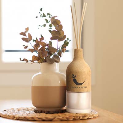 The TRENDS Natura Wooden Reed Diffuser is an elegant refillable reed diffuser.  French Pear fragrance.  Branding available - engraving or print. 