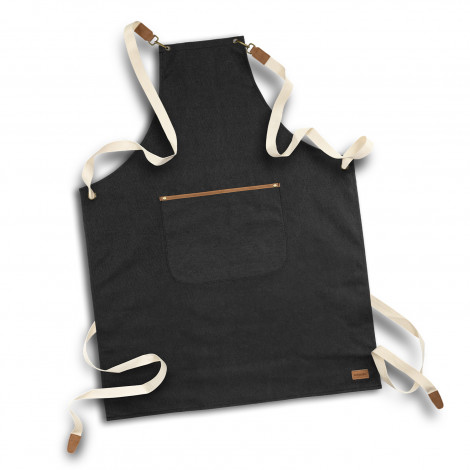 The Keepsake Canvas Apron is a 300gsm cotton canvas apron.  Washed Black finish.  Leather look front pocket.  Great option for cooking and kitchen related gifts. 