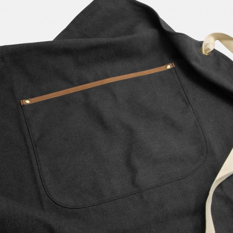 The Keepsake Canvas Apron is a 300gsm cotton canvas apron.  Washed Black finish.  Leather look front pocket.  Great option for cooking and kitchen related gifts. 