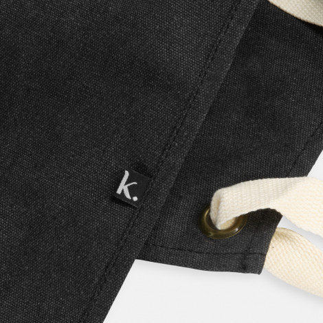 The Keepsake Canvas Apron is a 300gsm cotton canvas apron.  Washed Black finish.  Leather look front pocket.  Great option for cooking and kitchen related gifts. 