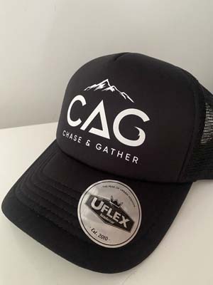 The Chase & Gather Trucker Cap is a black trucker cap with Chase & Gather logo on the front. Preorders may allow for additional colour ways to be ordered.
