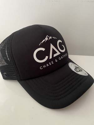 The Chase & Gather Trucker Cap is a black trucker cap with Chase & Gather logo on the front. Preorders may allow for additional colour ways to be ordered.